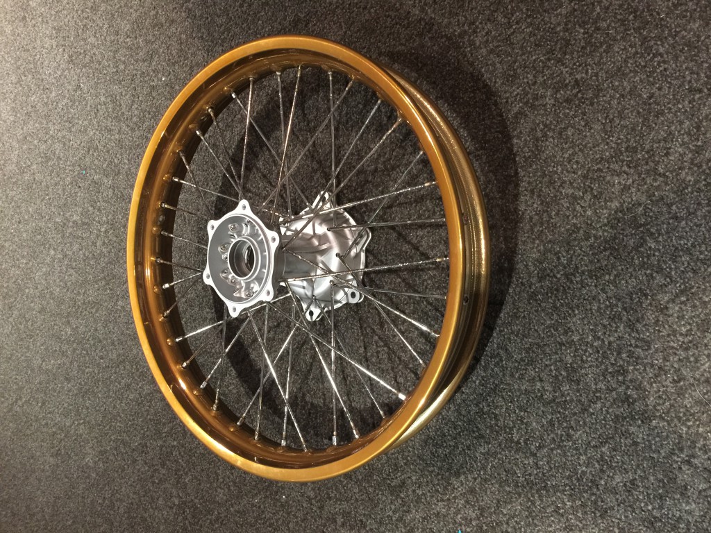 Refurbished hub, plated spokes and powder coated rims.